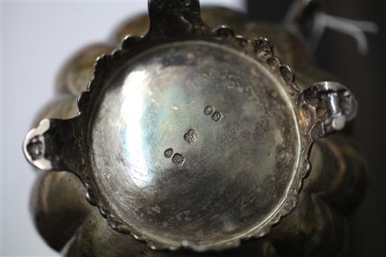 A William IV silver melon shaped two handled sugar bowl and matching cream jug, 20.5 oz.